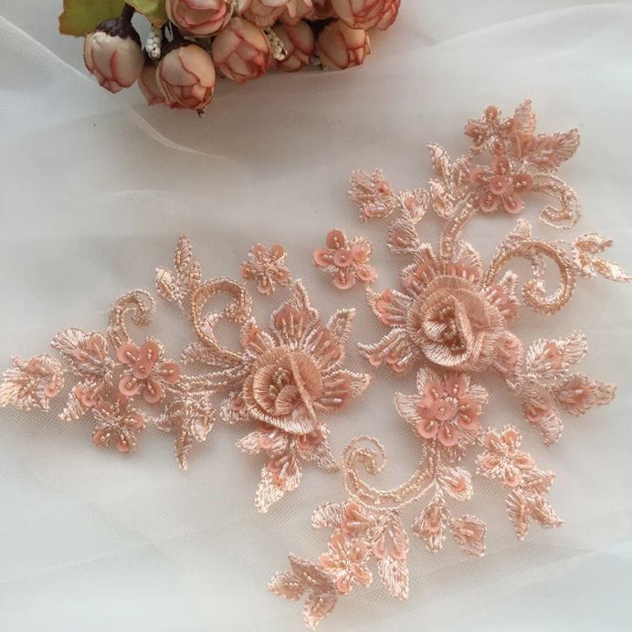 Enhance your designs with this exquisite 3D Apricot Floral Lace Applique, featuring intricate embroidery, delicate beaded accents, and layered floral details. Crafted with precision, this applique showcases soft apricot-hued threads woven into elegant roses and swirling vine motifs, perfect for couture gowns, bridal wear, dance costumes, and eveningwear.