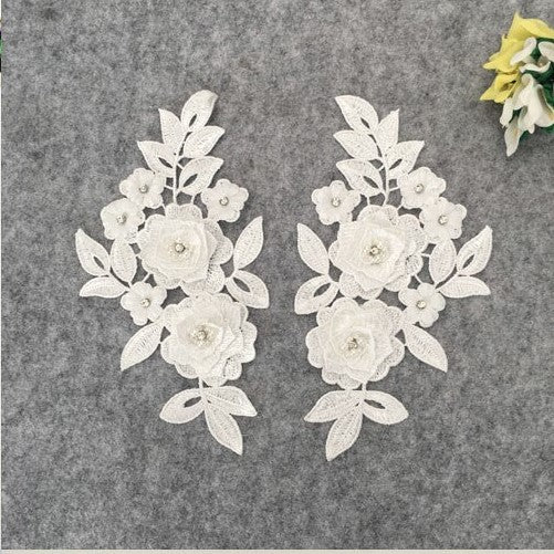 White Heavily embroidered 3D floral applique for dance costumes and bridal or eveningwear or craft.. 