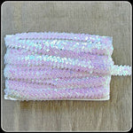 Iridescent pearl pink stretch elastic sequin trim.  Great for dance and stage costumes
