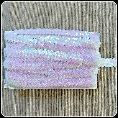 Iridescent pearl pink stretch elastic sequin trim.  Great for dance and stage costumes