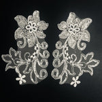 Very sparkly mirrorred pair ivory appliques with  a large single sequinned flower ,stems and leaves