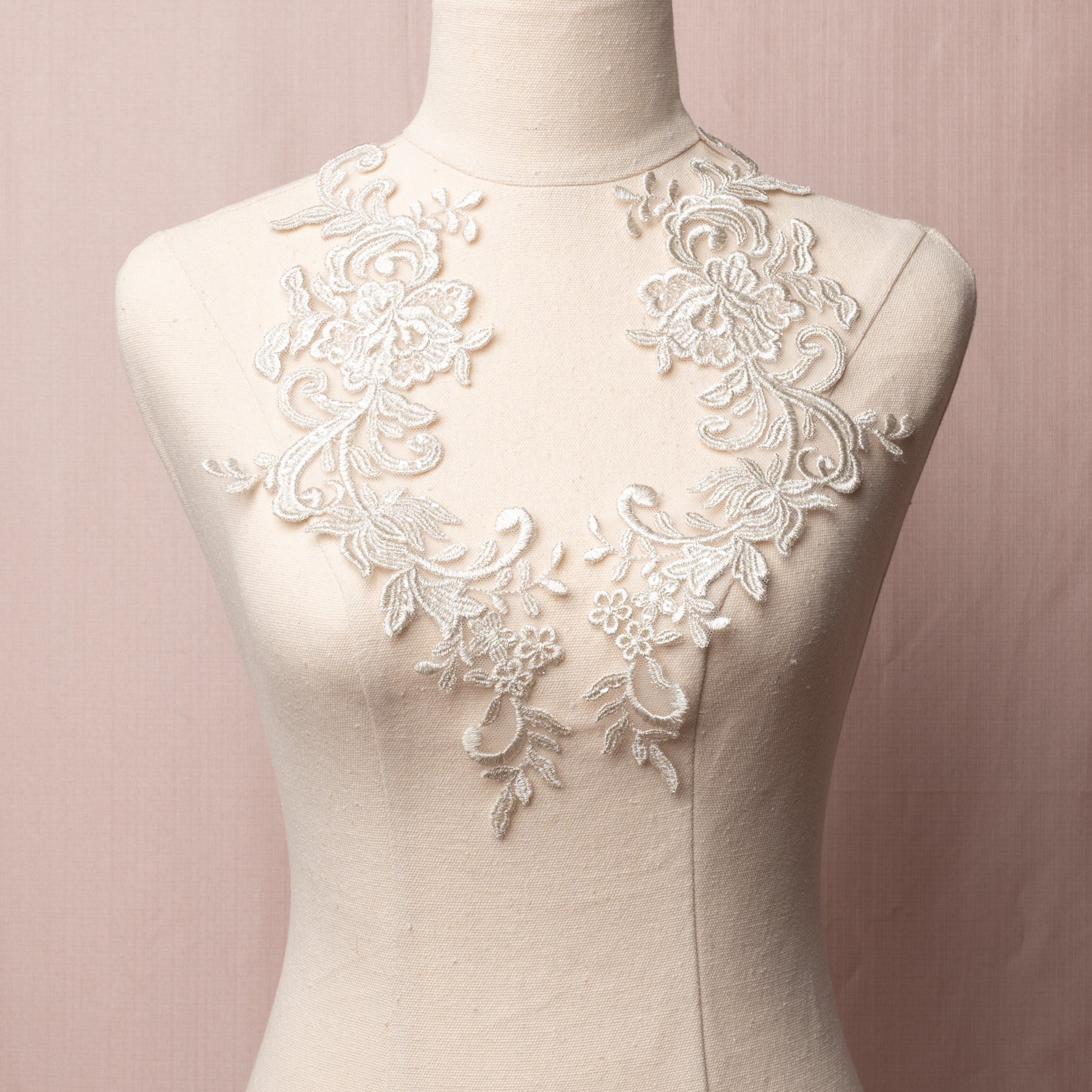 Heavily embroidered silver grey lace applique pair embellished with lurex thread and tiny sequins.