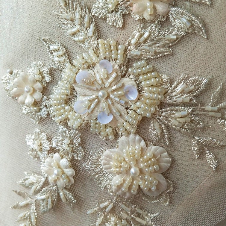 Cream and ivory beaded floral applique pair with 3D flowers laying flat.