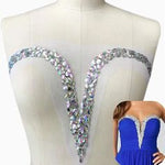A V neckline bodice applique sewn with AB crystals ,rhinestones sequins and beads displayed on a model next to a photo displaying it  on a blue evening dress. 