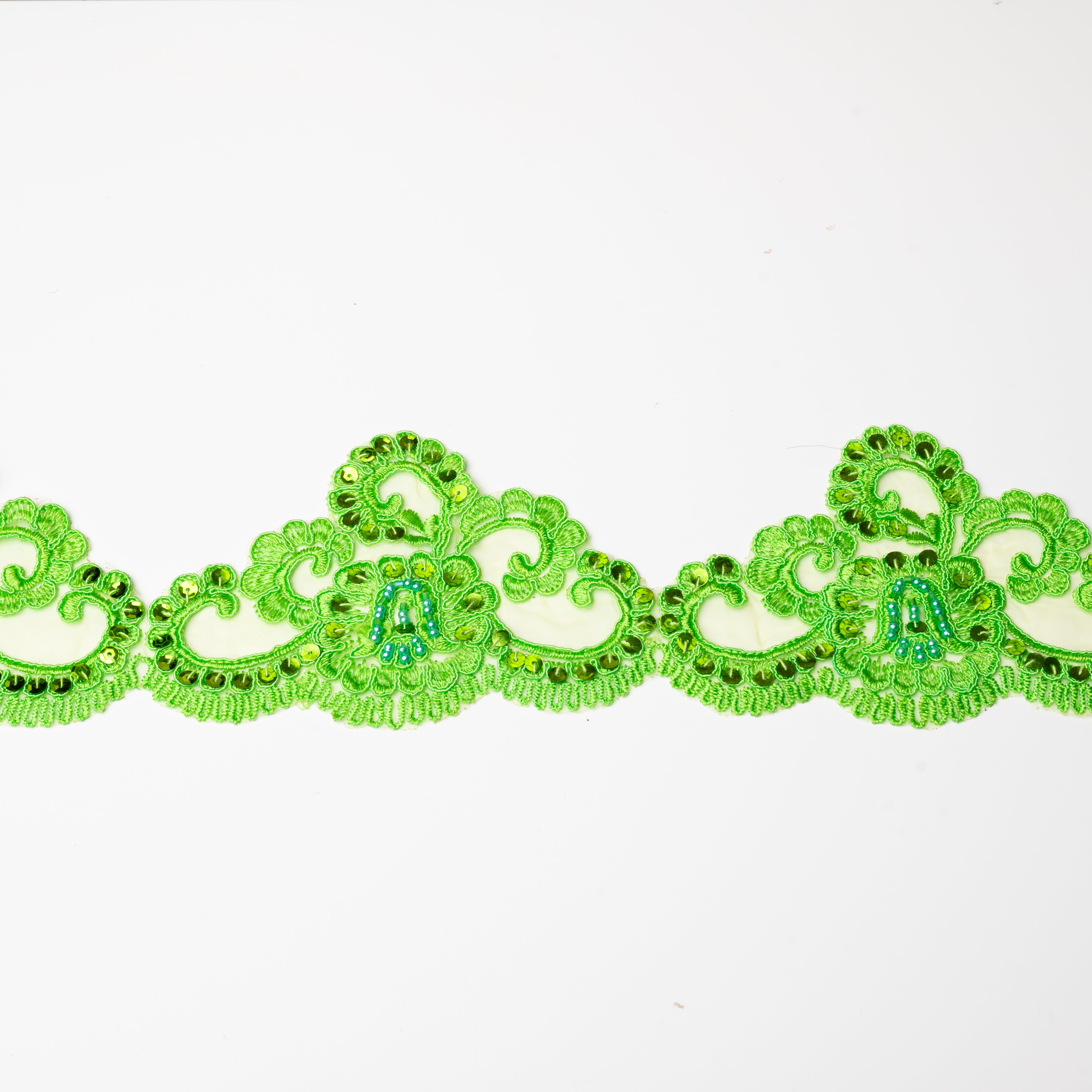 Green lace trim embellished with green sequins and blue pearls.