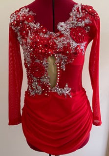 The red sequin applique is layered over silver lace adding movement , texture and the " wow" factor to the dance costume.