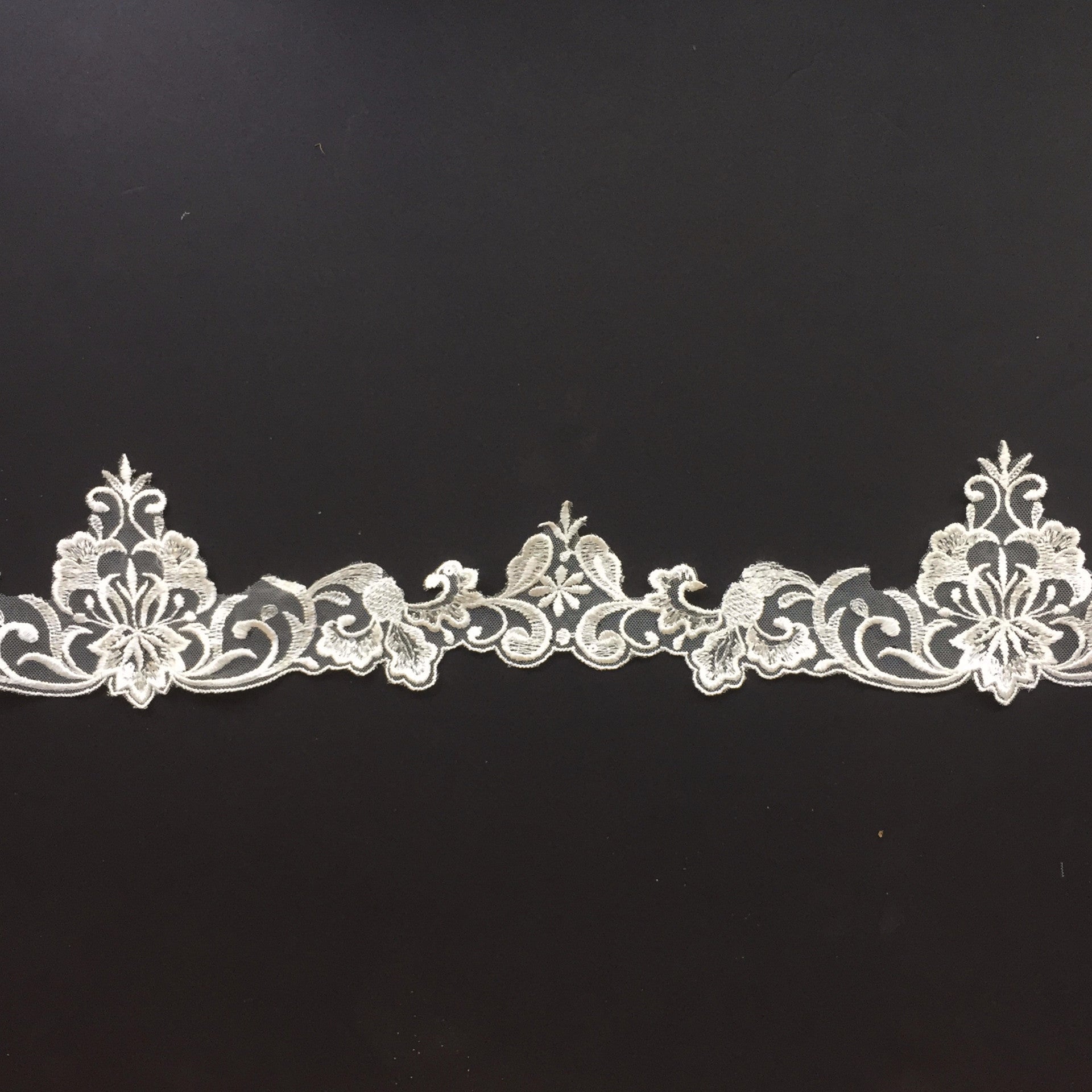 Ivory floral lace trim embellished with sequins, great for costumes and as a bridal veil trim