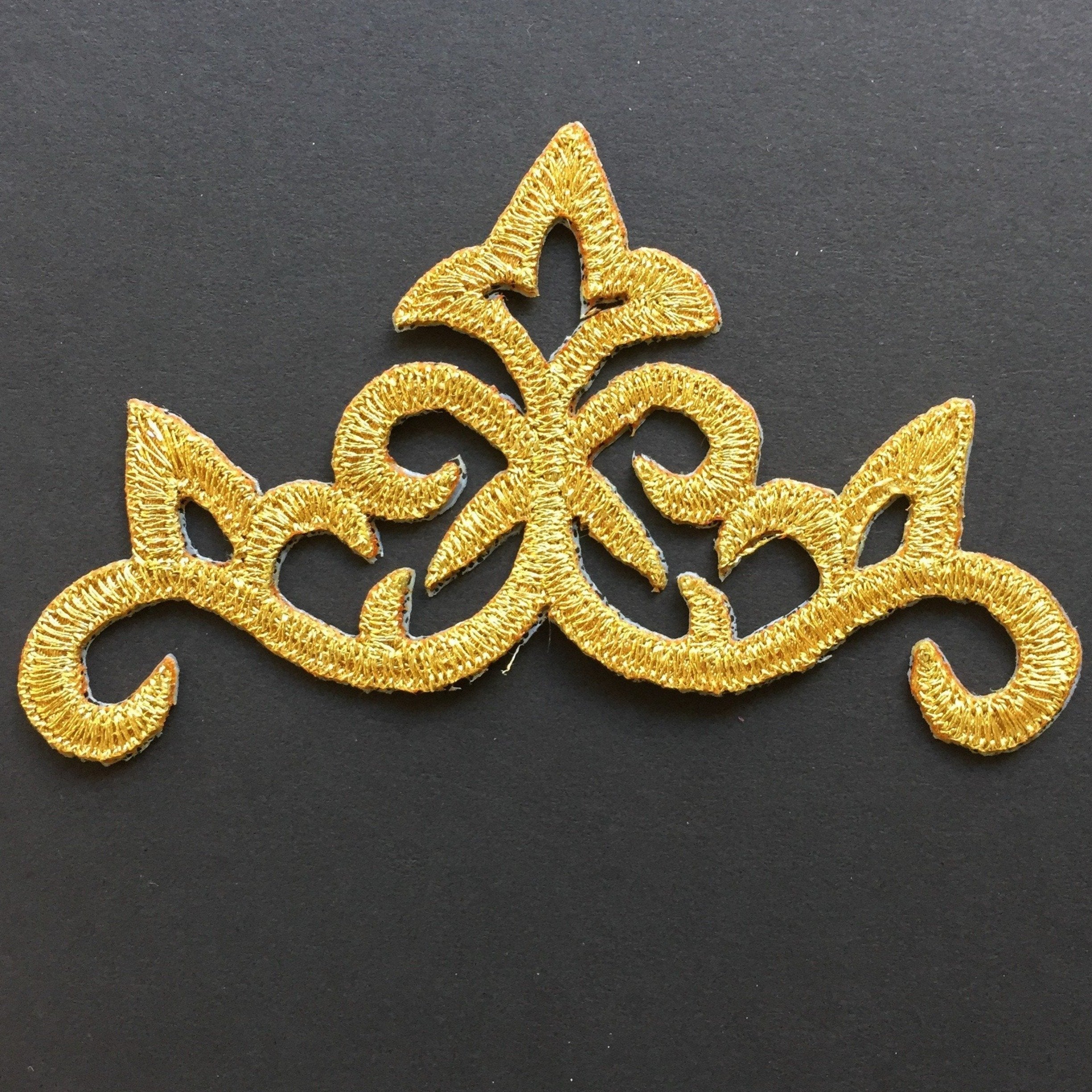 Baroque style iron on applique embroidered with metallic gold thread.  Great for cosplay and historical costumes.
