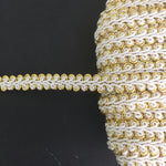 Metallic gold and white gimp braid trim.  This white central corded trim has a metallic gold outer edge.