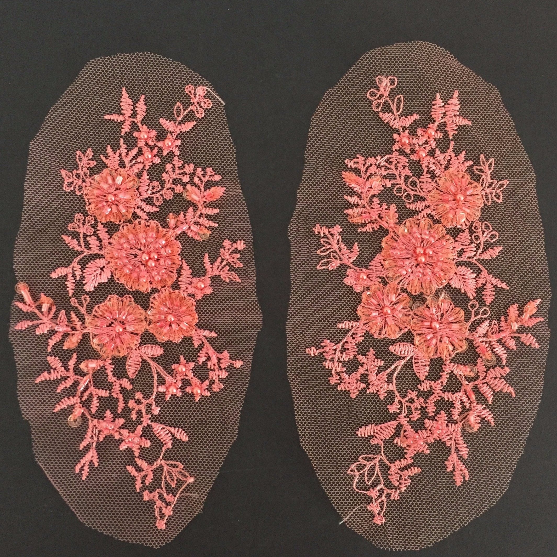 The applique comes as a mirrored pair which makes it perfect for achieving symmetrical bodice or costume designs. Heavily beaded apricot flowers are the focal point of the applique . Embroidered onto fine net , stems and leaves  surround the central flowers