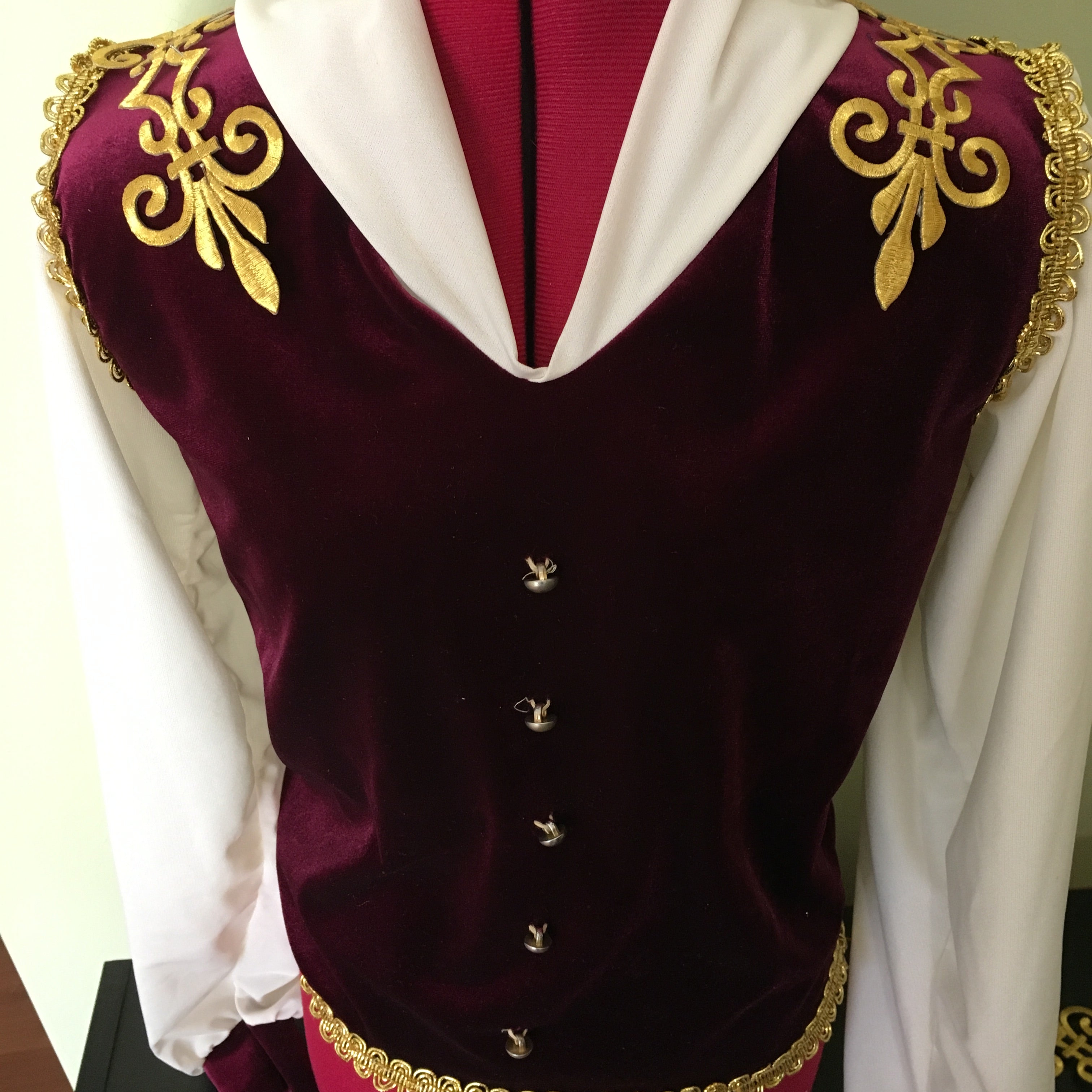 The gold embroidered baroque style appliques give the impression of epaulettes when placed across the shoulders of a boys military style costume 