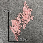 Pair of dusty pink embroidered appliques laying flat on a grey background.  The image shows the measurements of the appliques.  The appliques have two 3D flowers on each side and are embellished with crystals and pink pearls.