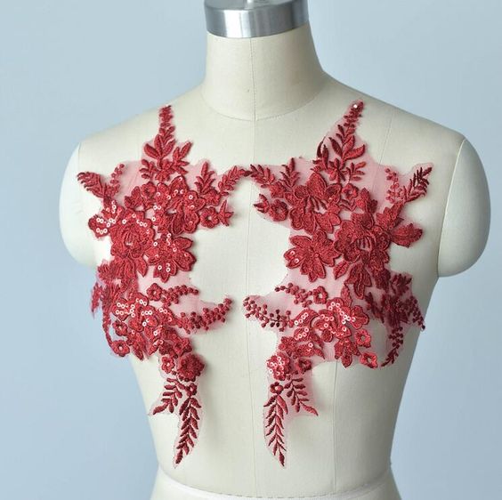 Beautiful burgundy applique embellished with sequins.