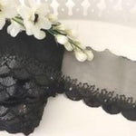 Black sequinned trim with a double scalloped edge. 