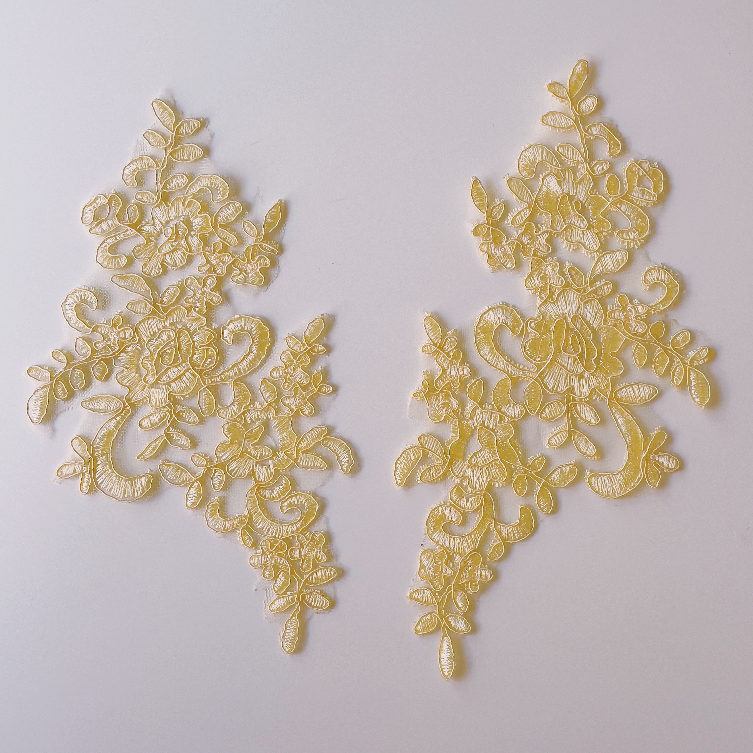 Lemon yellow embroidered corded floral applique pair.